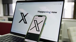 FILE - The opening page of X is displayed on a computer and phone, Oct. 16, 2023, in Sydney. 