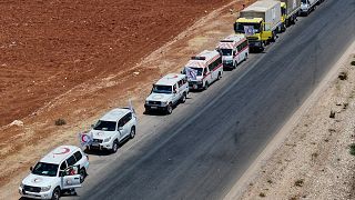 A convoy of the Syrian Arab Red Crescent carrying food and other aid, travels to the city of Sweida in rural Daraa province, Syria, Wednesday, July 23, 2025.