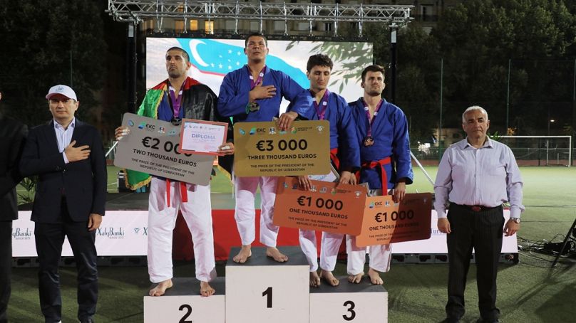 Kurash competitors personify the saying no guts, no glory 