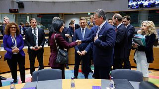 EU Commissioner for Trade Maros Sefcovic speaks with Germany's Minister for Economic Affairs Katherina Reiche.
