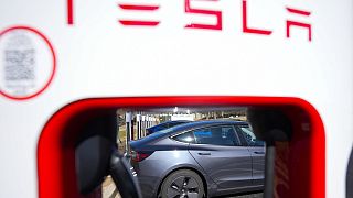 A Tesla level three Electric vehicle charger is visible, Feb. 2, 2024, in Kennesaw, Ga., near Atlanta.