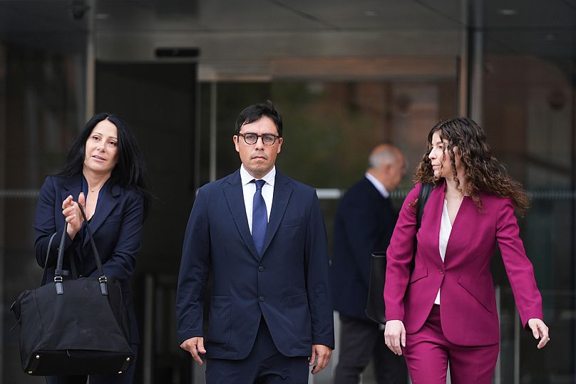 Dr. Salvador Plasencia, centre, and his attorneys Debra S. White, left, and Karen L. Goldstein, leave federal court in Los Angeles, 23 July 2025