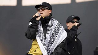 Liam Ohana, member of Kneecap, performs during a show at Finsbury Park in London, Saturday 5 July 2025. 