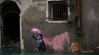 Banksy's migrant child mural is partially submerged in Venice, Italy, 15 November 2019