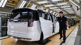 A worker gives a final check on Zeekr EV models at the Chinese automaker Zeekr assembly plant, in Ningbo, east China's Zhejiang Province on April 16, 2025 (AP Photo/Andy Wong)