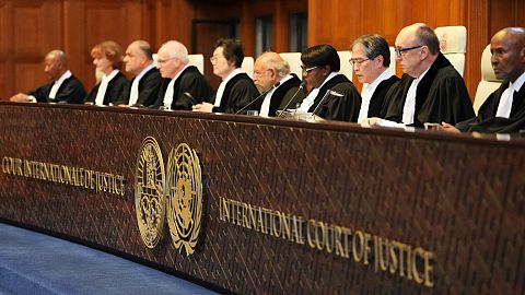 Presiding judge Yuji Iwasawa, third from right, speaks at the International Court of Justice .
