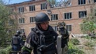 Rescuers work at a damaged city hospital that was hit by a Russian guided air bomb in Kharkiv, Ukraine, Friday, July 25, 2025.