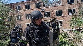 Rescuers work at a damaged city hospital that was hit by a Russian guided air bomb in Kharkiv, Ukraine, Friday, July 25, 2025.