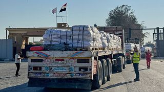 Aid trucks move toward Gaza as Israel begins tactical pause