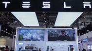 People visit a booth of Tesla during the 3rd China International Supply Chain Expo at the China International Exhibition Center. Beijing, China. 18 July 2025.