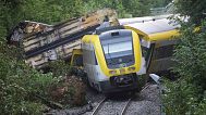 Wagons of a derailed regional passenger train lie on a railroad line near Riedlingen, Germany, Monday, July 28, 2025. 
