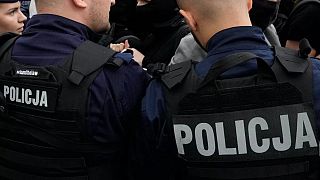 Police officers try to break up group of demonstrators in Warsaw, 19 July, 2025