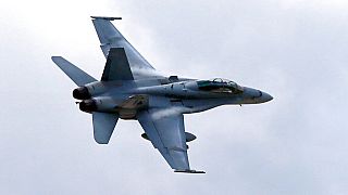 FILE: In this April 12, 2013, file photo, a U.S. Marine F/A-18 Hornet jet flies low pass during Philippines-US joint military exercise in northern Philippines. 
