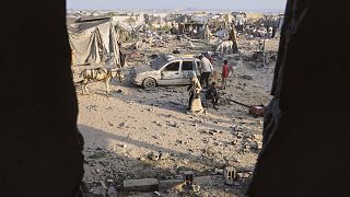 Palestinians inspect the site struck by an Israeli bombardment in Muwasi, Khan Younis, Gaza Strip, Monday, July 28, 2025