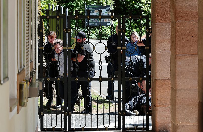 Demonstrators from Animal Rebellion are arrested by the police after entering the grounds of the Nürnberg Zoo, 29 July, 2025