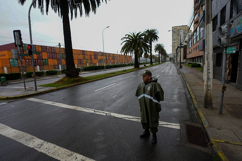 A police officer patrols a street near the sea during a precautionary tsunami advisory in Valparaiso in Chile, 30 July, 2025