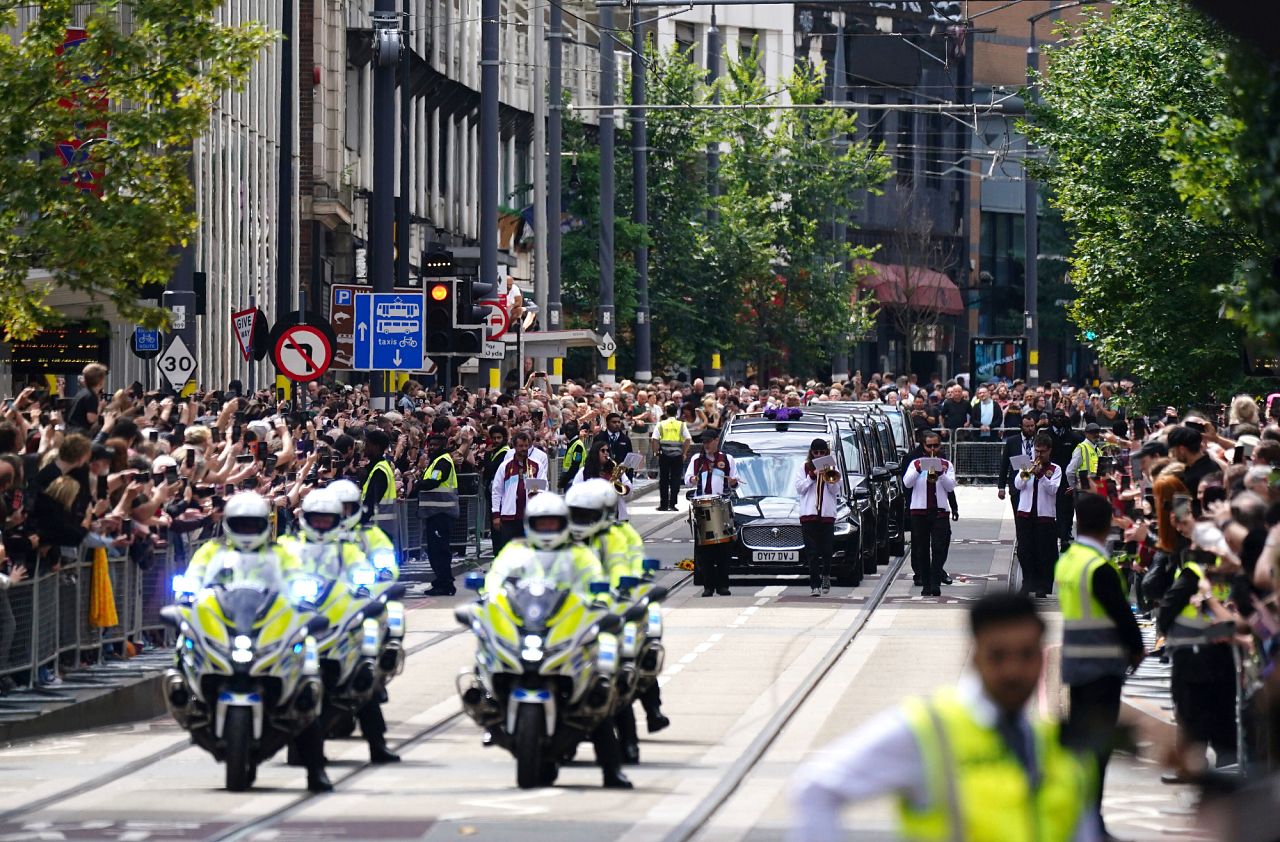 The funeral cortege of Black Sabbath frontman Ozzy Osbourne travels along Broad Street