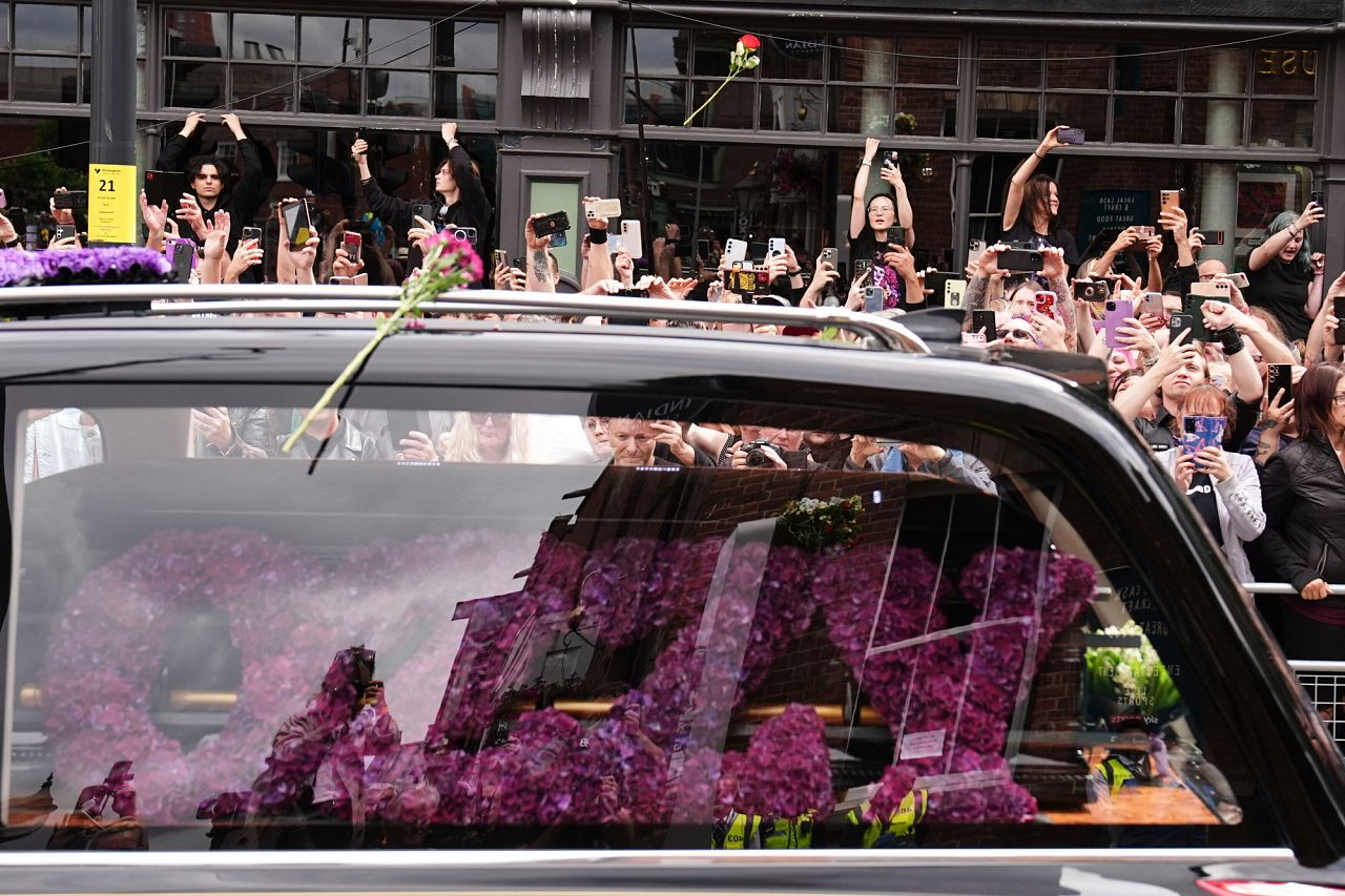 The funeral cortege of Black Sabbath frontman Ozzy Osbourne travels along Broad Street
