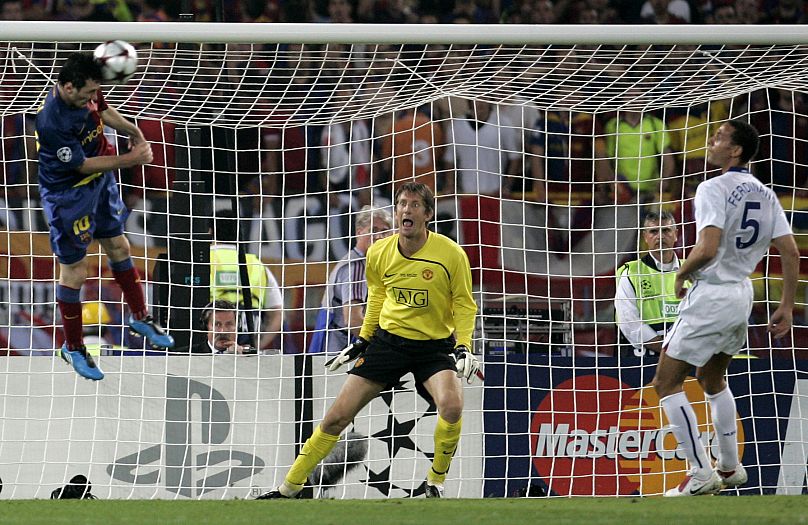 Barcelona's Lionel Messi, left, scores on a header during the UEFA Champions League final football match between Manchester United and Barcelona in Rome, 27 May 2009. 