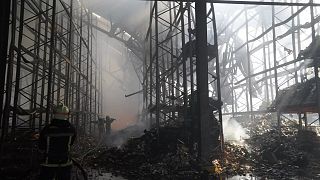 Firefighters tackle the blaze after a Russian air attack that hit a food warehouse in Kharkiv, 30 July, 2025