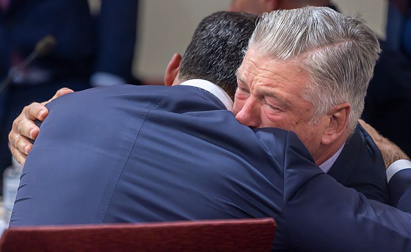 Actor Alec Baldwin hugs his attorney after a judge dismisses the involuntary manslaughter case over the 2021 fatal Rust shooting. 