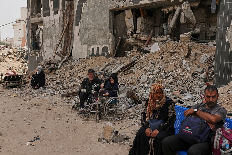Kidney patients sit amid the destruction caused by the Israeli army at Shifa Hospital compound in Gaza City, 1 July, 2025