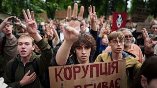 Participants gather at a protest against a law targeting anti-corruption institutions in front of the Ukrainian parliament in Kyiv, 31 July, 2025