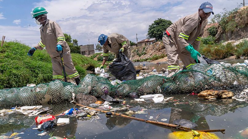 Alexandra Water Warriors volunteers cleanup the Juksei river in the heart of Alexandra township from plastic pollution in Johannesburg, South Africa, November 2024. 