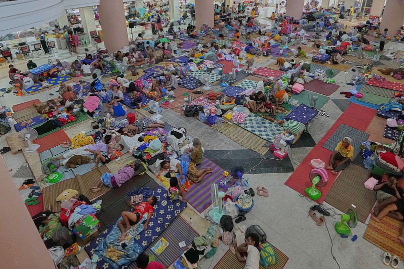 Thai residents who fled homes following the border clashes rest at an evacuation centre in Surin province, 30 July, 2025