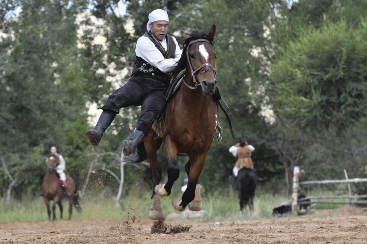 A Kyrgyz rider shows his skills during the Salbuurun Festival 