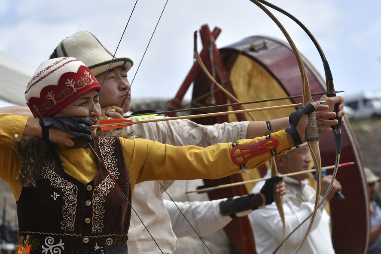 Kyrgyz hunters compete in archery during the Traditional Eagle Hunting Salbuurun Festival on the southern shore of Issyk-Kul lake