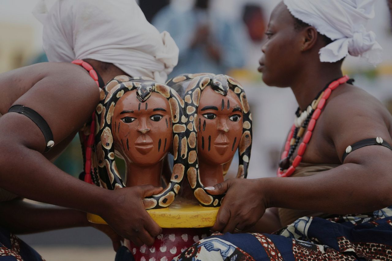 People dressed in costumes perform during the mask festival in Porto-Novo, Benin.
