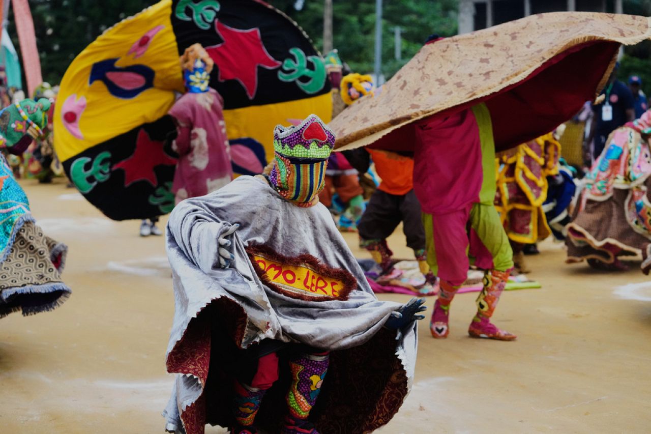 People dressed in costumes perform during the mask festival in Porto-Novo, Benin.