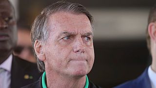 Brazil's former President Jair Bolsonaro gives a press conference outside the Senate in Brasilia, Brazil, Thursday, July 17, 2025