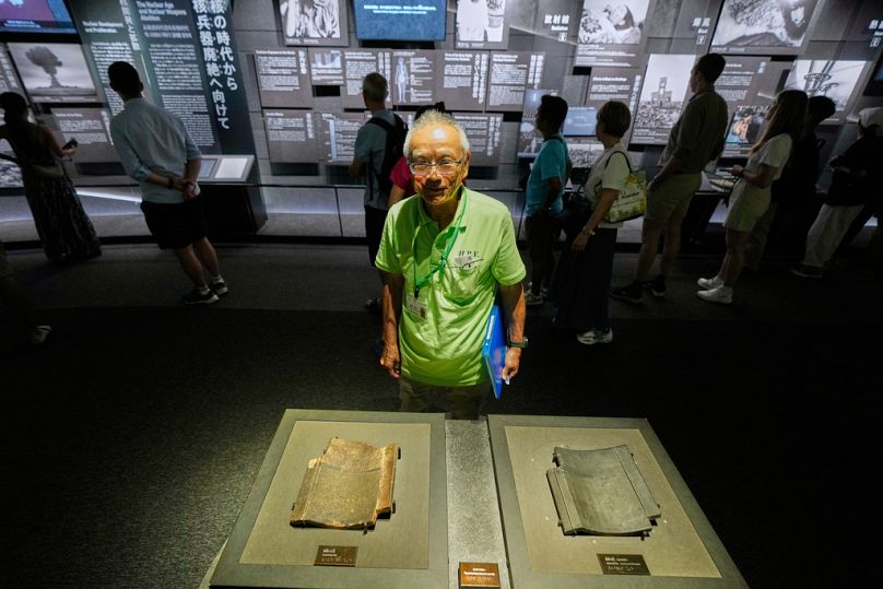 Katsumi Takahashi, a Hiroshima Peace Volunteer at Hiroshima Peace Culture Foundation, waits for visitors at Peace Memorial Museum.