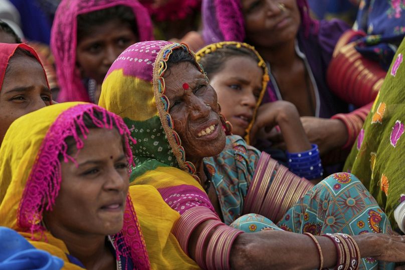 Villagers watch a performance of a Pakistani folk musician Sham Bhai at a village in Umerkot, Pakistan. 