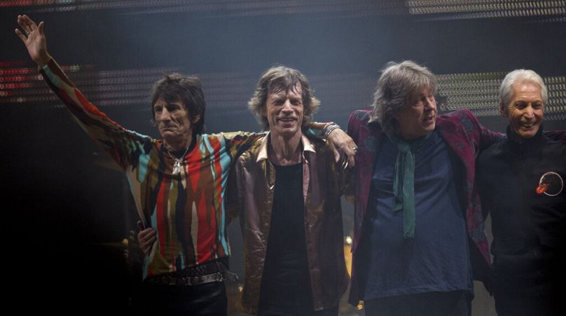 Ronnie Wood, from left to right, Mick Jagger, Mick Taylor and Charlie Watts of the British band the Rolling Stones after performing at Glastonbury in 2013.