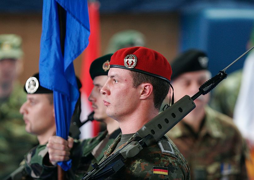 FILE: An honour guard of EUFOR soldiers marches during the handover ceremony of comand, in Sarajevo, 5 December 2006