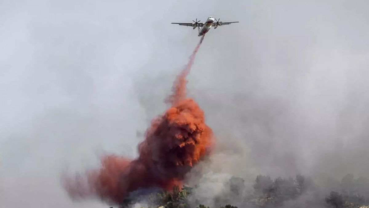 At least one person killed in massive wildfire in southern France