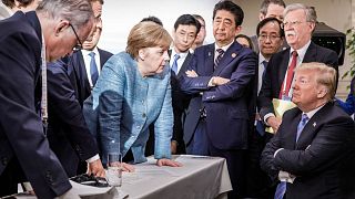 President Donald Trump meets with German Chancellor Angela Merkel and other leaders during G7 Canada, 2018.