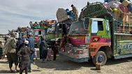 Afghan refugees wait for clearance to leave for their homeland at a transit station on the outskirts of Chaman, 9 April, 2025