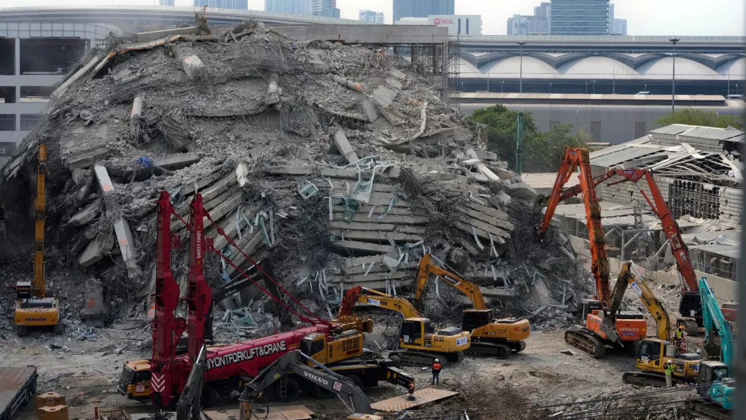 Heavy machinery deployed to clear the rubble from an under construction high-rise building that collapsed in Bangkok, 2 April, 2025