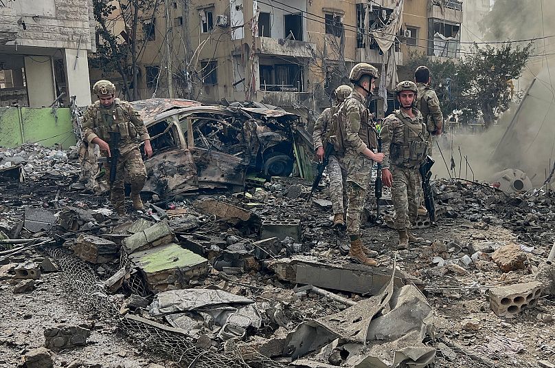 Lebanese soldiers inspect the site that was hit by an Israeli airstrike in Dahiyeh, 28 March, 2025