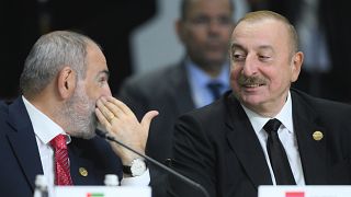 Armenian Prime Minister Nikol Pashinyan, left, and Azerbaijani President Ilham Aliyev attend Outreach/BRICS Plus format session on the sidelines of the BRICS summit in Kazan