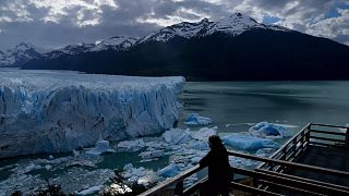 A tourist watches the Perito Moreno Glacier at Los Glaciares National Park, near El Calafate, Argentina.