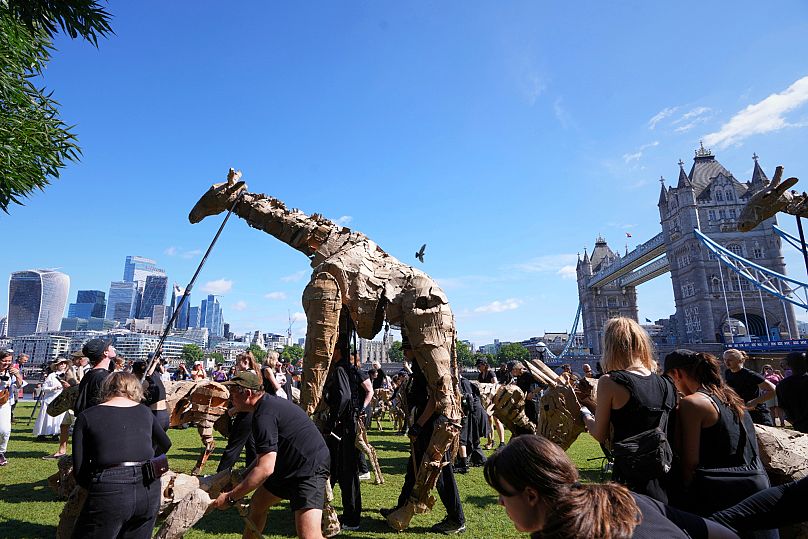 Life size animal puppets from The Herds perform in London on 27 June 2025. 