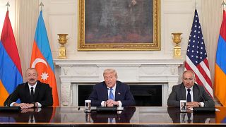 US President Donald Trump sits during a trilateral signing with Azerbaijan's President Ilham Aliyev and Armenia's Premier Nikol Pashinyan in the White House, 8 August 2025