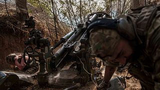 Ukrainian servicemen of the 148th artillery brigade fire from a M777 howitzer towards Russian positions at the frontline in Zaporizhzhia region, Ukraine, on Aug. 7, 2025.