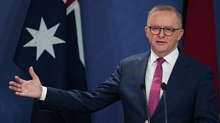 FILE: Australian Prime Minister Anthony Albanese gestures during a press conference in Sydney, 12 December 2024.