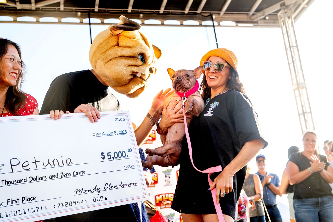 THE WINNER: Petunia and owner Shannon Nyman win first place in the World's Ugliest Dog Contest 